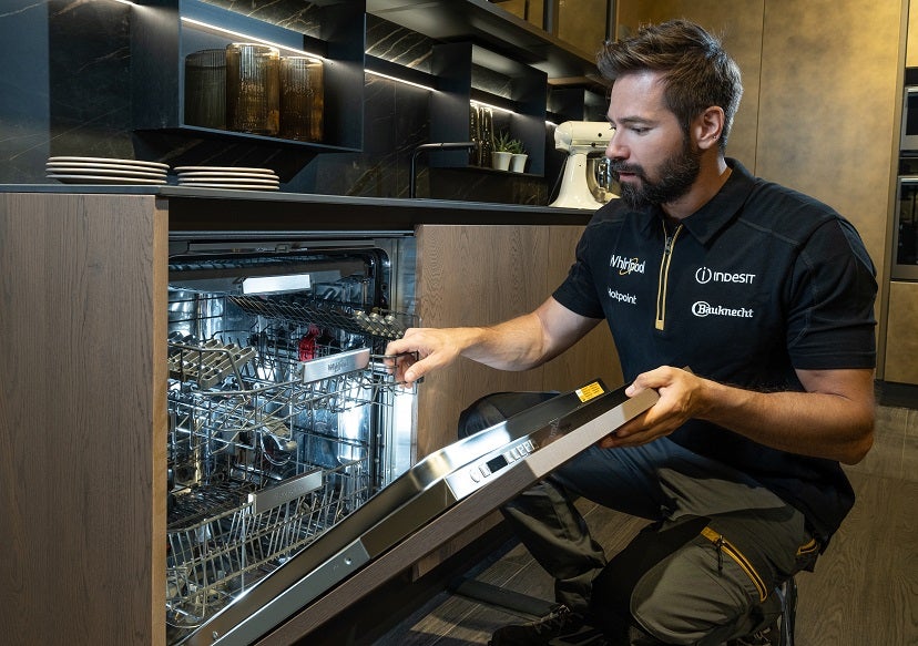 Hotpoint engineer fixing a dishwasher 
