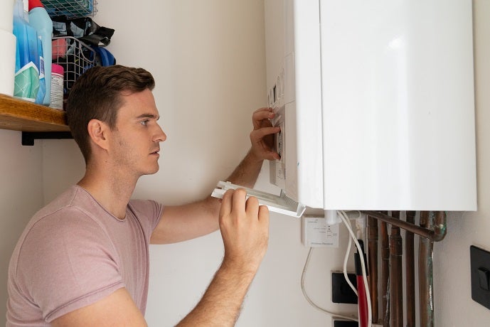 Man checking boiler